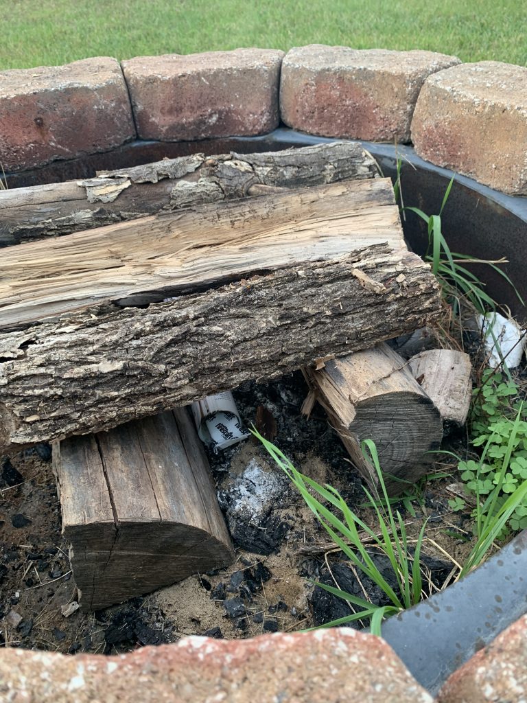 Place the Firestart Firelighter inside rolled up papers